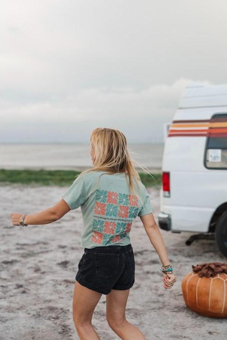 Sage green t-shirt with a colorful geometric floral mosaic back print
